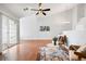 Bright living room with ceiling fan, sliding door access to the balcony at 3242 E 103Rd Dr # 602, Thornton, CO 80229