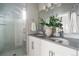 Luxurious bathroom with double vanity, modern fixtures, and a glass-enclosed shower at 2733 W 28Th Ave # 6, Denver, CO 80211