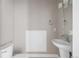 This half bathroom features a pedestal sink, modern fixtures, and a white toilet at 2733 W 28Th Ave # 6, Denver, CO 80211