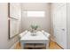 Cozy dining area with a white table, seating for four, and natural light at 2733 W 28Th Ave # 6, Denver, CO 80211