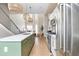 Modern kitchen with a green island, stainless steel appliances, and an open floor plan at 2733 W 28Th Ave # 6, Denver, CO 80211