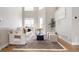 Spacious living room with high ceilings and natural light, featuring a comfortable sofa and stylish decor at 2733 W 28Th Ave # 6, Denver, CO 80211