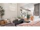 Open-concept living room and kitchen offers modern decor, hardwood floors, and natural light from the high ceilings at 2733 W 28Th Ave # 6, Denver, CO 80211