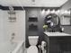 Stylish bathroom featuring a tub, floating shelves, sleek vanity, and modern fixtures at 6755 S Ivy St # A7, Centennial, CO 80112