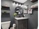 Stylish bathroom showcasing a sleek vanity, floating shelves, and modern fixtures at 6755 S Ivy St # A7, Centennial, CO 80112