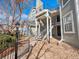 Exterior view of the building featuring stairs to the upper level and rock landscaping at 6755 S Ivy St # A7, Centennial, CO 80112