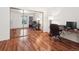 Spacious office area with two desks, ergonomic chairs, and a mirrored closet reflecting the room at 6755 S Ivy St # A7, Centennial, CO 80112