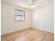 Empty bedroom showcasing hardwood floors and natural light at 9256 W Euclid Ave, Littleton, CO 80123