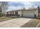 Charming ranch style home with a two-car garage and inviting curb appeal at 9256 W Euclid Ave, Littleton, CO 80123