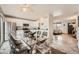 Eat-in kitchen area featuring a modern glass table and access to the living room at 9256 W Euclid Ave, Littleton, CO 80123