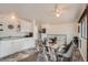Bright and airy kitchen with modern appliances and an adjacent dining area at 9256 W Euclid Ave, Littleton, CO 80123