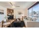 Inviting living room featuring hardwood floors, a fireplace, and comfortable seating at 9256 W Euclid Ave, Littleton, CO 80123