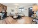 Bright living room with hardwood floors, a fireplace, and plenty of natural light at 9256 W Euclid Ave, Littleton, CO 80123