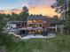 Aerial view of the estate showcasing the home and surrounding landscape at sunset at 347 S White Tail Dr, Franktown, CO 80116