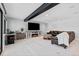Basement is fully finished, featuring tile and carpeted floors, a fireplace and a leather sofa at 347 S White Tail Dr, Franktown, CO 80116