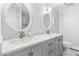 Elegant bathroom features a double vanity with marble countertop and decorative mirrors at 347 S White Tail Dr, Franktown, CO 80116