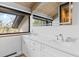 Bright bathroom features a double sink vanity with a large window at 347 S White Tail Dr, Franktown, CO 80116