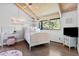 Bright bedroom features a four poster bed, wood ceiling, wood floor and a light-up nameplate at 347 S White Tail Dr, Franktown, CO 80116