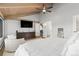 Bright bedroom featuring a large dresser, vaulted ceilings, and a comfortable seating area at 347 S White Tail Dr, Franktown, CO 80116