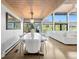 Open-concept dining area featuring a large table with seating and abundant natural light at 347 S White Tail Dr, Franktown, CO 80116