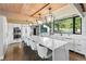 Bright, modern kitchen with a large center island, stainless steel appliances, and ample counter space, perfect for cooking at 347 S White Tail Dr, Franktown, CO 80116