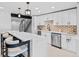 Kitchen features stainless steel appliances, quartz countertops and breakfast bar seating at 347 S White Tail Dr, Franktown, CO 80116