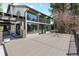 Stunning rear exterior with expansive deck and floor-to-ceiling windows, offering scenic views at 347 S White Tail Dr, Franktown, CO 80116