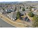 A nice aerial view of the neighborhood with a pond and mountain views at 13535 W 62Nd Ln, Arvada, CO 80004