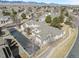 A high angle shows residential street and houses with mountain views at 13535 W 62Nd Ln, Arvada, CO 80004