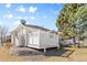 Backyard view showing deck, siding, and grass at 13535 W 62Nd Ln, Arvada, CO 80004