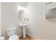 Neat powder room featuring a pedestal sink at 13535 W 62Nd Ln, Arvada, CO 80004
