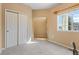 Bedroom with double closets and window at 13535 W 62Nd Ln, Arvada, CO 80004
