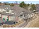 Charming home with a landscaped yard, two-car garage, mountain views, and sidewalk access at 13535 W 62Nd Ln, Arvada, CO 80004