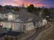 Charming home with a landscaped yard, two-car garage, mountain views at sunset, and sidewalk access at 13535 W 62Nd Ln, Arvada, CO 80004