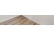 Close up view of luxury vinyl plank flooring installation at 13535 W 62Nd Ln, Arvada, CO 80004