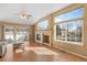 Bright living room featuring hardwood floors, a fireplace and sliding door access to outdoor area at 13535 W 62Nd Ln, Arvada, CO 80004