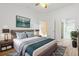 Comfortable main bedroom with ensuite bathroom, soft decor, and plenty of light at 13535 W 62Nd Ln, Arvada, CO 80004