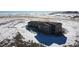 Aerial view of a house with a large yard at 11100 Haskell Creek Rd, Larkspur, CO 80118