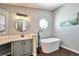 Elegant bathroom featuring a soaking tub and modern vanity at 11100 Haskell Creek Rd, Larkspur, CO 80118