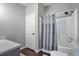 Simple bathroom with a shower/tub combo, toilet, and vanity at 11100 Haskell Creek Rd, Larkspur, CO 80118