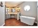 Bathroom with corner soaking tub and double vanity at 11100 Haskell Creek Rd, Larkspur, CO 80118