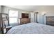 Spacious bedroom with large windows and dresser at 11100 Haskell Creek Rd, Larkspur, CO 80118