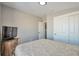 Comfortable bedroom with a dresser and double door closet at 11100 Haskell Creek Rd, Larkspur, CO 80118