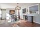 Dining area with hardwood floors, featuring a farmhouse style table at 11100 Haskell Creek Rd, Larkspur, CO 80118