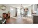 Open concept dining room with entryway and kitchen views at 11100 Haskell Creek Rd, Larkspur, CO 80118