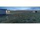 Exterior view of home and shed at 11100 Haskell Creek Rd, Larkspur, CO 80118