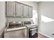 Laundry room with LG washer and dryer at 11100 Haskell Creek Rd, Larkspur, CO 80118