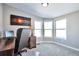 Bright home office featuring a large window and built-in desk at 11100 Haskell Creek Rd, Larkspur, CO 80118