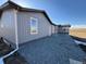 Attractive home exterior featuring gravel landscaping, improving curb appeal while reducing maintenance at 11100 Haskell Creek Rd, Larkspur, CO 80118