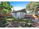 Charming backyard featuring a small patio with outdoor seating, bordered by a wooden fence at 4157 Perry St, Denver, CO 80212